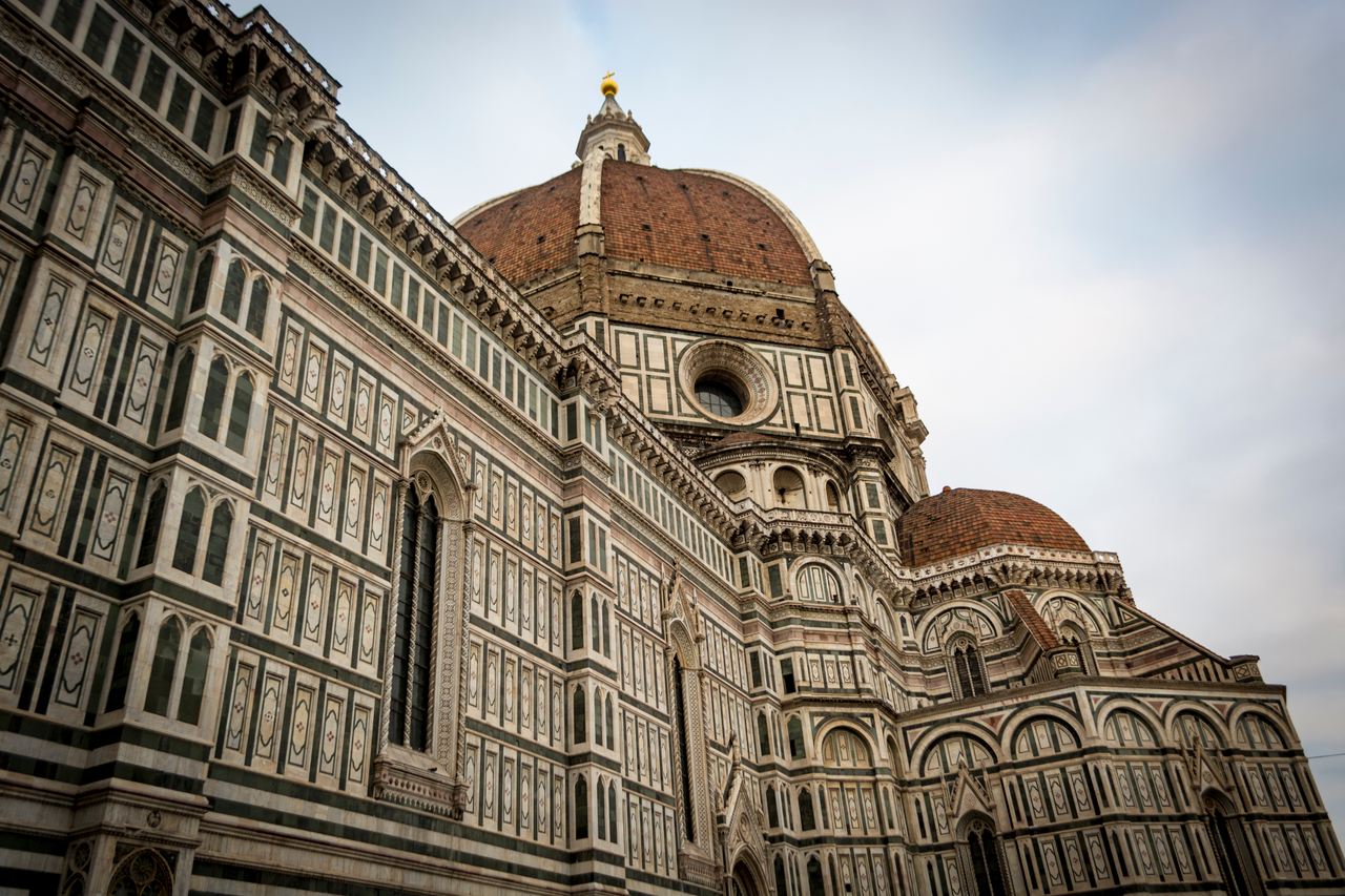 Close-up of Brunelleschi's Dome at Florence Cathedral, showcasing intricate architectural details.